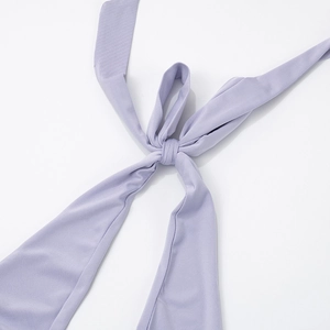 Detailed close-up of lavender halter dress neck ties with soft jersey fabric texture