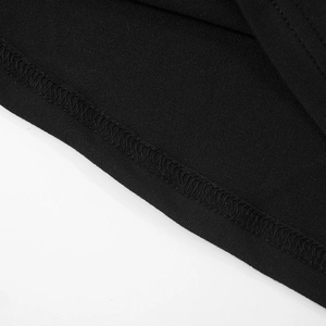 Detailed close-up showing precision double-needle stitching on black knitted fabric