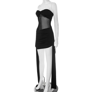 Detail of black strapless mini dress with mesh patchwork and elegant side ribbons