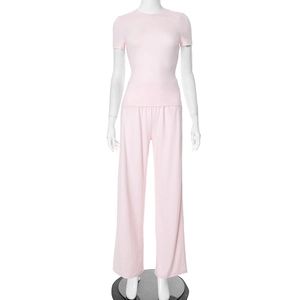 Close-up of light pink two-piece casual lounge set with t-shirt and wide-leg trousers