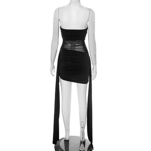 Detail of ruched black bodycon mini dress featuring mesh panels and long side streamers