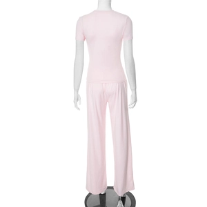 Rear view of pink long-sleeve top and wide-leg trousers lounge set on a mannequin