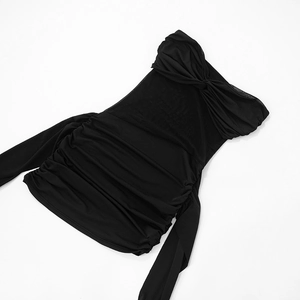 Detailed view of the black ruched bodycon dress with elegant twist knot chest detail