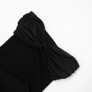 Macro shot of the black mesh dress detail featuring pleated crossover knot design