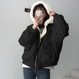 Detail of hooded jacket featuring contrast plush lining and large utility pockets