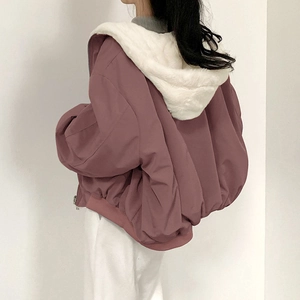 Detailed back view of a pink hooded jacket with warm white faux fur lining texture