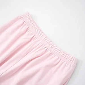 Detailed macro view of pink elastic waistband with neat stitching on soft knit fabric
