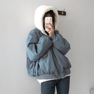 Detail of grey-blue zip-up jacket featuring a white fleece hood and ribbed sleeve cuffs