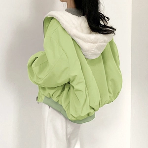 Women's green hooded winter jacket with white faux fur lining and elastic hem detail