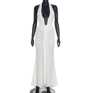Detail of elegant white halter neck maxi dress with deep V-neck and ruched waist texture