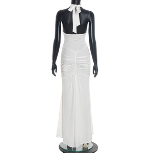 Detail view of the elegant white halter neck backless dress with ruched gathering on the back