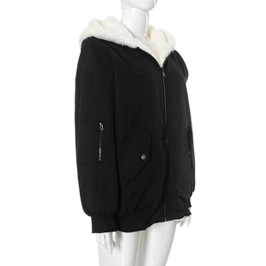 Detail of hooded jacket with warm faux shearling lining and metal zipper closure