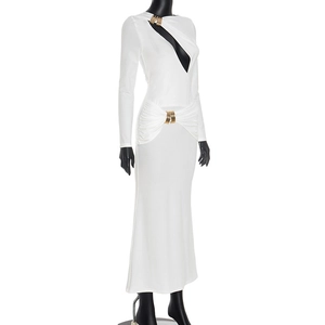 Detail of white long sleeve dress with cutout neckline and gold metal ring hardware