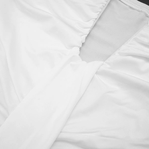 Detail view of white V-neck dress fabric showing knit texture and gathered pleats