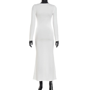 Close-up of elegant long sleeve white knit maxi dress showing smooth fabric and stitching