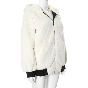 Close-up of cream faux fur hooded jacket with black zipper and ribbed cuffs details