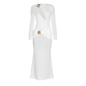 Detail of elegant white long-sleeve dress with hollow-out design and gold ring ornament