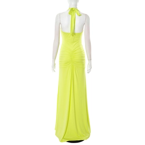 Detail of the back ruched design and halter neck tie on the neon green maxi dress