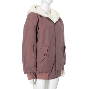 Detailed view of women's hooded jacket with thick faux fur lining and utility sleeve pocket