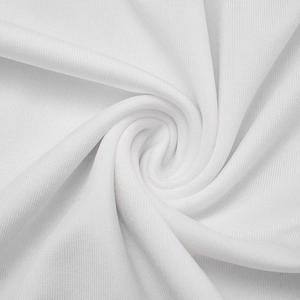 Macro view showing the soft white knitted fabric texture of a long elegant dress