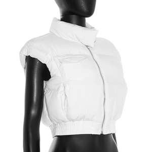 Close-up of white padded vest featuring elastic waist, zipper and flap chest pocket