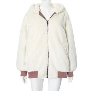 Detail of plush hooded jacket showing pink ribbed cuffs and zipper closure on cream fabric