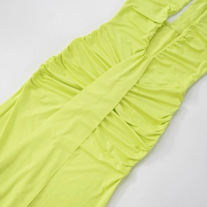 Detail view of the elegant lime green pleated fabric with stylish ruched texture design