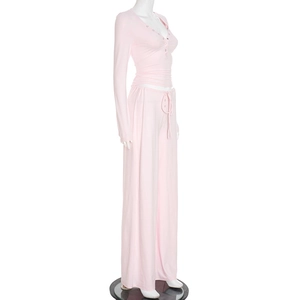 Detail of pink ribbed knit loungewear set with button-up top and drawstring pants