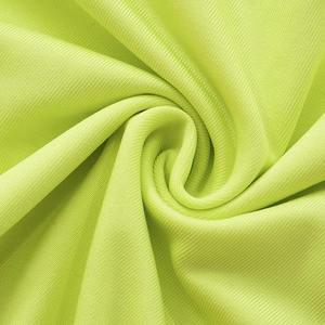 Macro shot of fluorescent green ribbed knit fabric showing fine vertical texture and elasticity