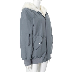 Detailed view of gray hooded jacket with white faux shearling lining and sleeve pocket