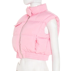 Close-up of pink puffer vest featuring metal zipper and adjustable drawstring hem