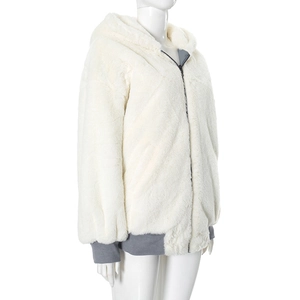 Detail of cream faux fur hooded jacket featuring dark grey ribbed cuffs and zipper trim