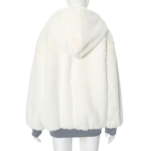 Detail view of white faux fur hoodie showing grey ribbed cuffs and plush texture