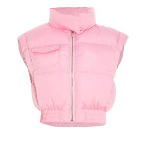 Detail of pink puffer vest showing metal zipper, cargo pocket and elastic hem