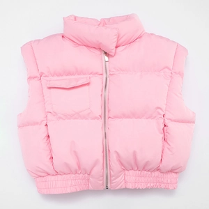 Detail of light pink quilted vest featuring standing collar, metal zipper and chest pocket