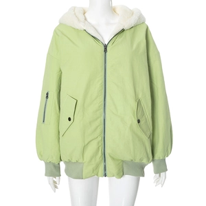 Detail of light green hooded jacket featuring white faux shearling lining and sleeve pocket