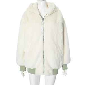 Detail of white faux fur hoodie showing black zipper and light green ribbed cuffs