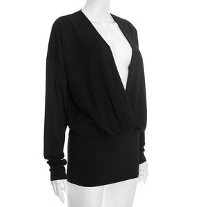 Detail of elegant black deep V-neck wrap dress with batwing sleeves and draped fabric