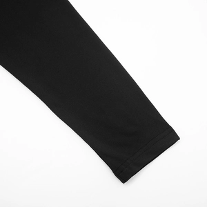 Detail view showing the neat double-needle stitching on black batwing sleeve cuff