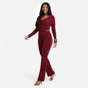 Detail of burgundy cowl neck long sleeve top and high waist trousers set for women