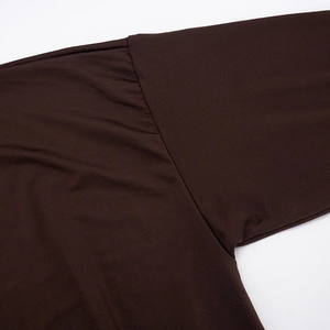 Detail of shoulder seam and armpit stitching on dark brown batwing sleeve dress