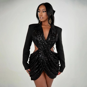 Detail view of black sequin mini dress with side waist cut-outs and wrap style