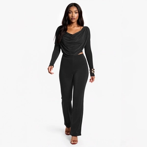 Elegant black two-piece set with long sleeve draped neck top and high waist flared pants
