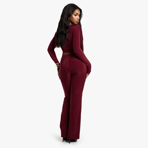 Rear view of a burgundy slim-fit two-piece set featuring a long sleeve top and flare pants