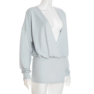 Close-up of deep V-neckline and pleat details on this light blue long sleeve dress
