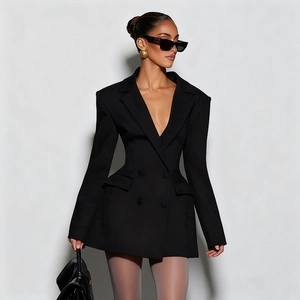 Detail of slim fit double-breasted blazer dress with structured shoulders and waist