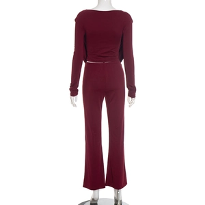 Rear view of wine red two-piece set featuring long sleeve crop top and wide leg pants