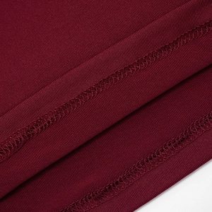 Detail view of wine red knit fabric with durable double-needle stitching on the hem