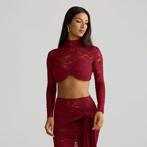 Detail of burgundy lace long sleeve top and matching skirt with cascading waist tie
