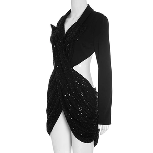 Detail of elegant black sequin patchwork dress with waist cutout and blazer collar